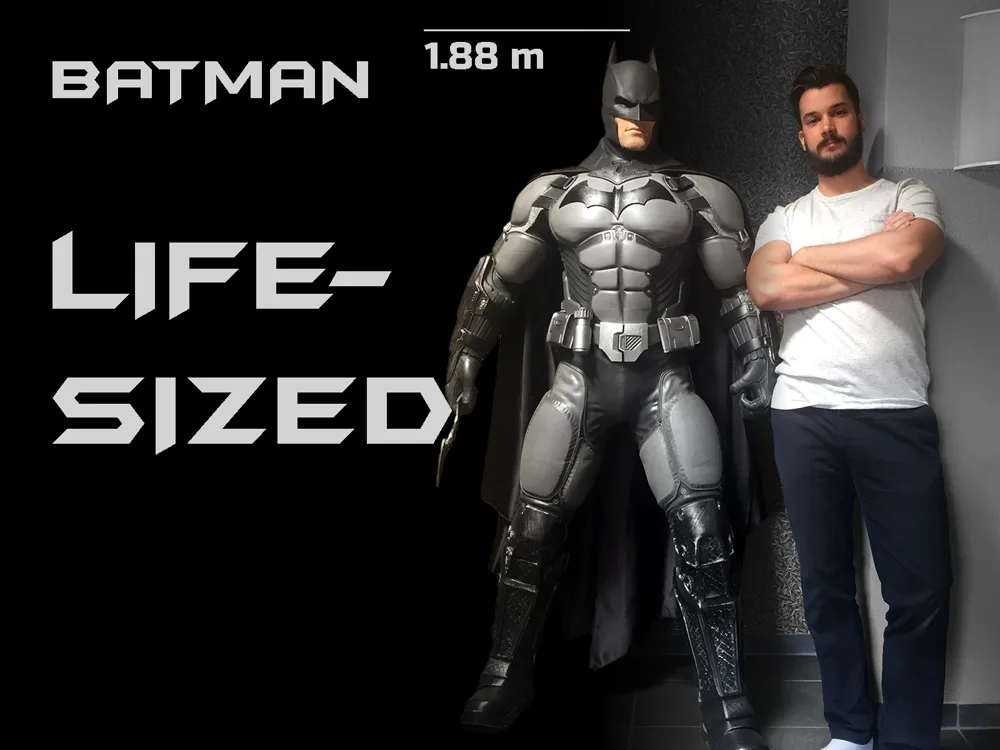 Life-size Batman character statue beside a person for scale